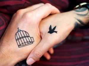 bird and cage tattoo