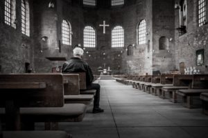 Man alone in church