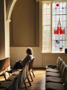 Woman sitting in an empty church