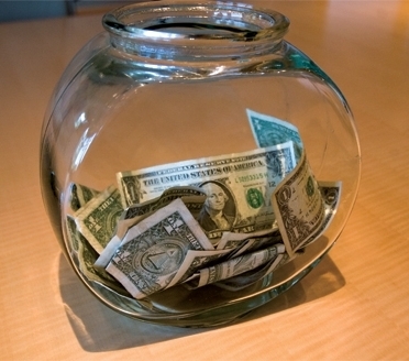 Dollar bills in a fishbowl