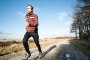 Man running on a country road