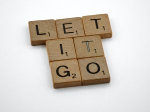 Scrabble tiles say "Let it Go"