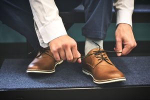 Man tying shoes