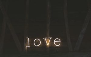 neon sign that says "love"