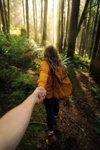 Woman walking int he woods