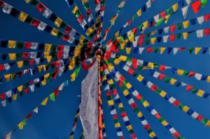 Prayer flags against a blue sky