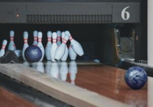 bowling ball striking pins