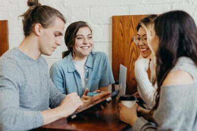 Young adults working and laughing together